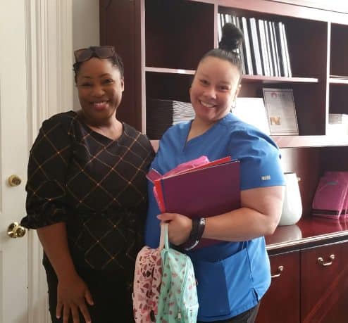 AIPHC Holds Back to School Supplies Event aiphc community section 4 scaled 494x459 1